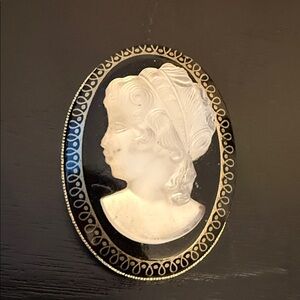 Clear Glowing Glass Cameo of a Lady on a Jet Black Glass Background